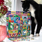 Cat interacting with a colorful puzzle box featuring cat-themed illustrations.