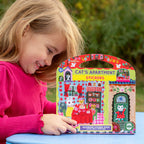 Child holding a 'Cat's Apartment' stickers pack with a colorful design
